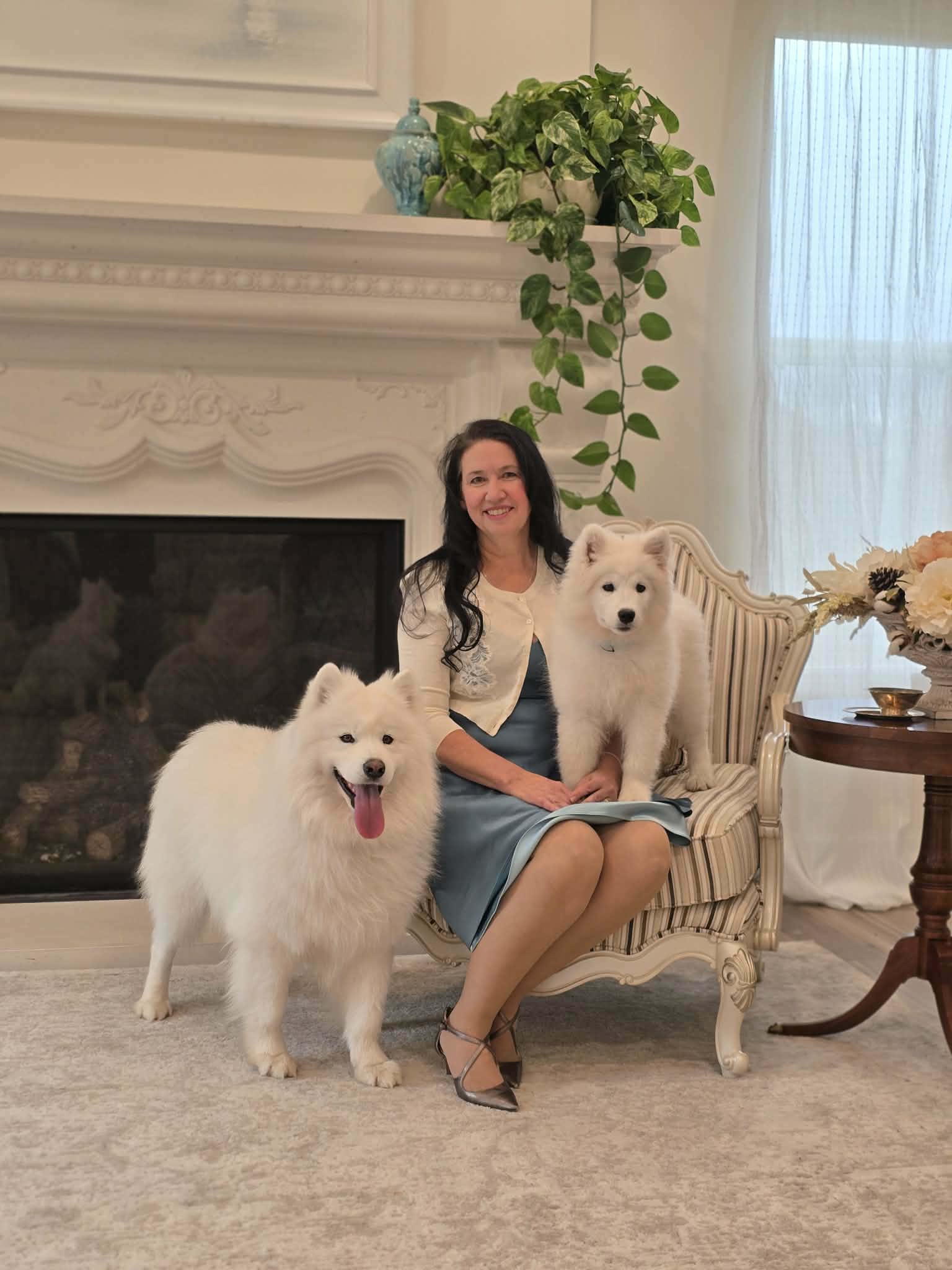 Sheri with two of her Samoyeds
